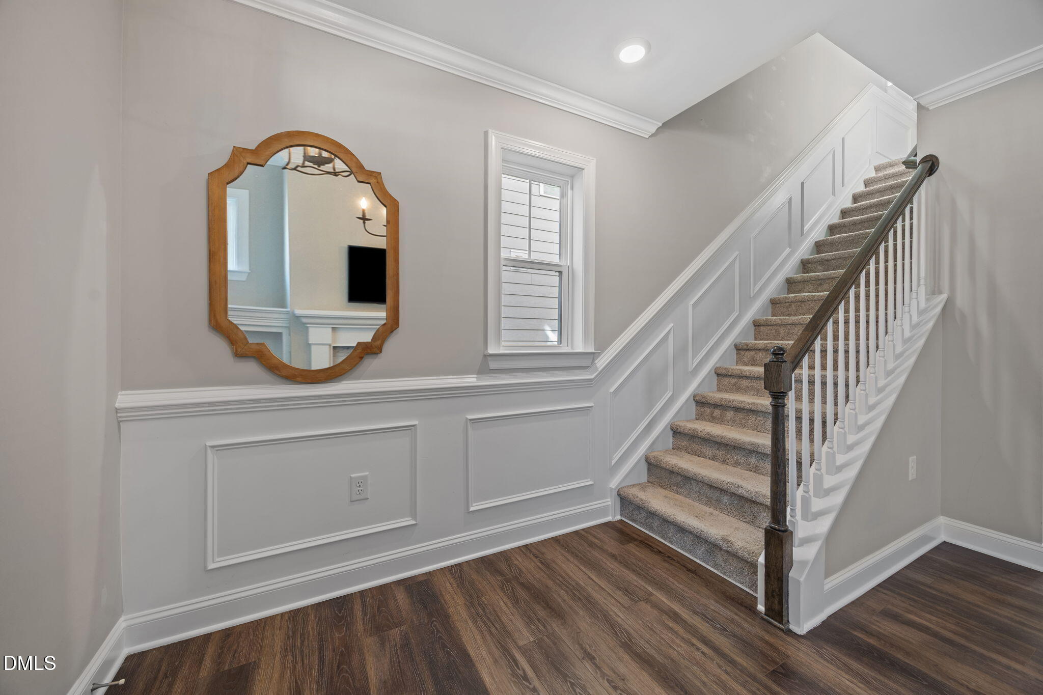 217 Masden Road Holly Springs, NC 27540 - Photo 13 of 32 a view of a livingroom with wooden floor and staircase