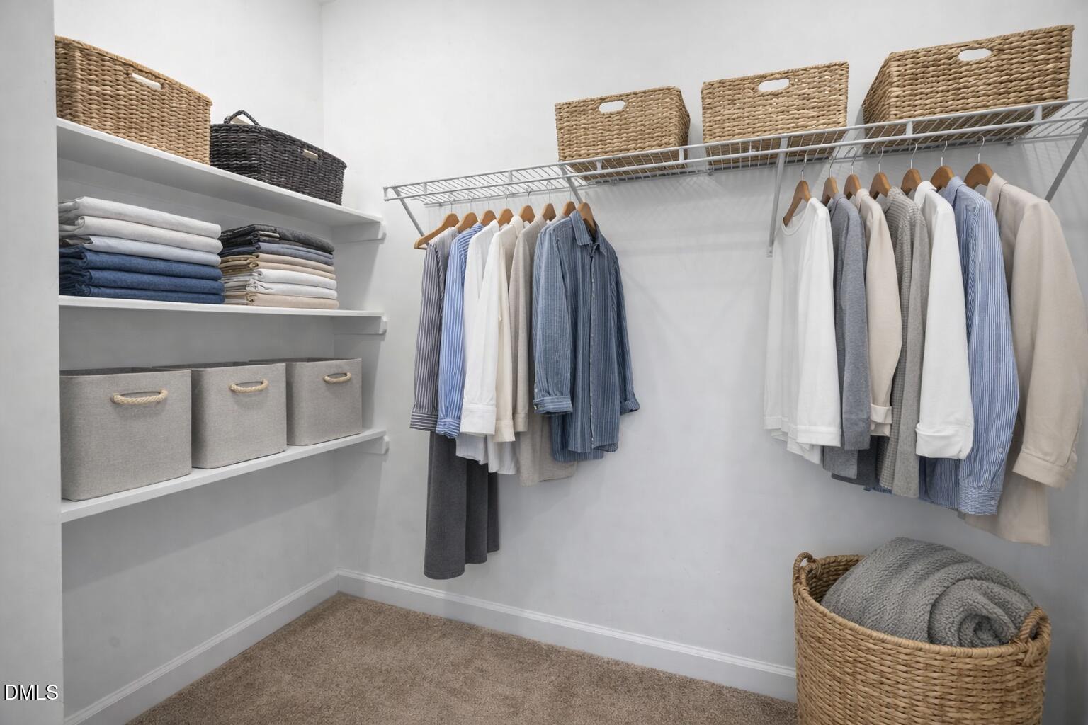 217 Masden Road Holly Springs, NC 27540 - Photo 18 of 32 a view of walk in closet with clothes and shoes