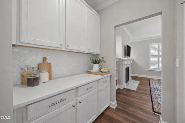 a bedroom with a bed dresser and a window