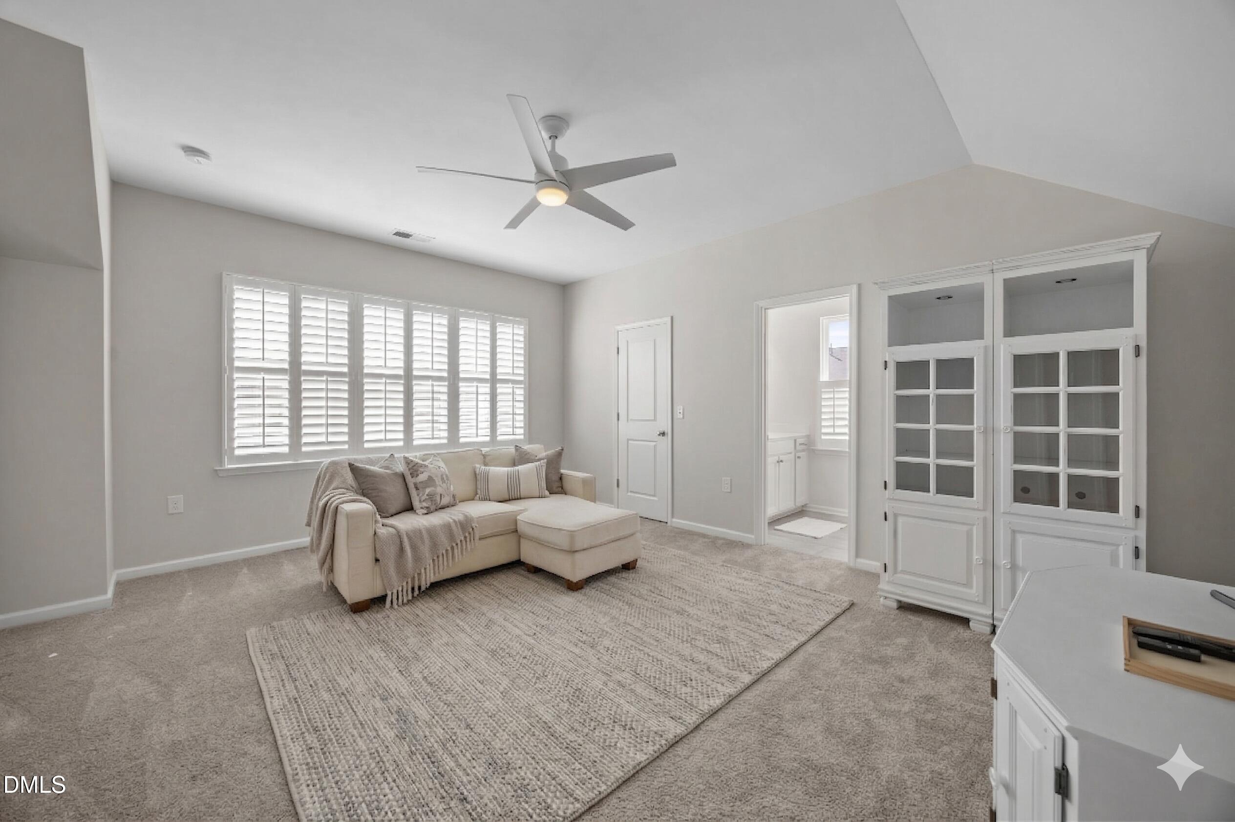 217 Masden Road Holly Springs, NC 27540 - Photo 25 of 32 a living room with furniture and windows