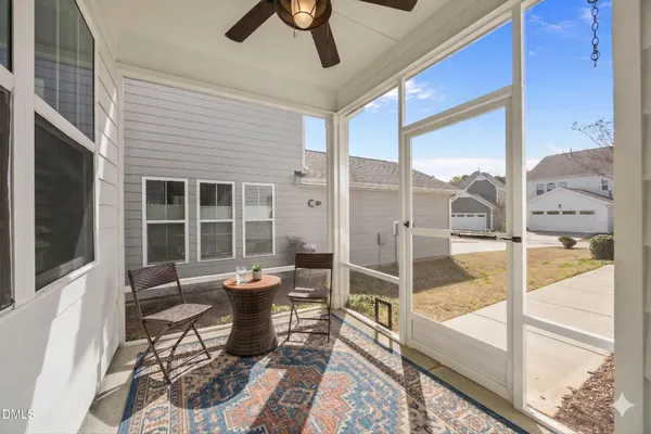 a living room with furniture and windows