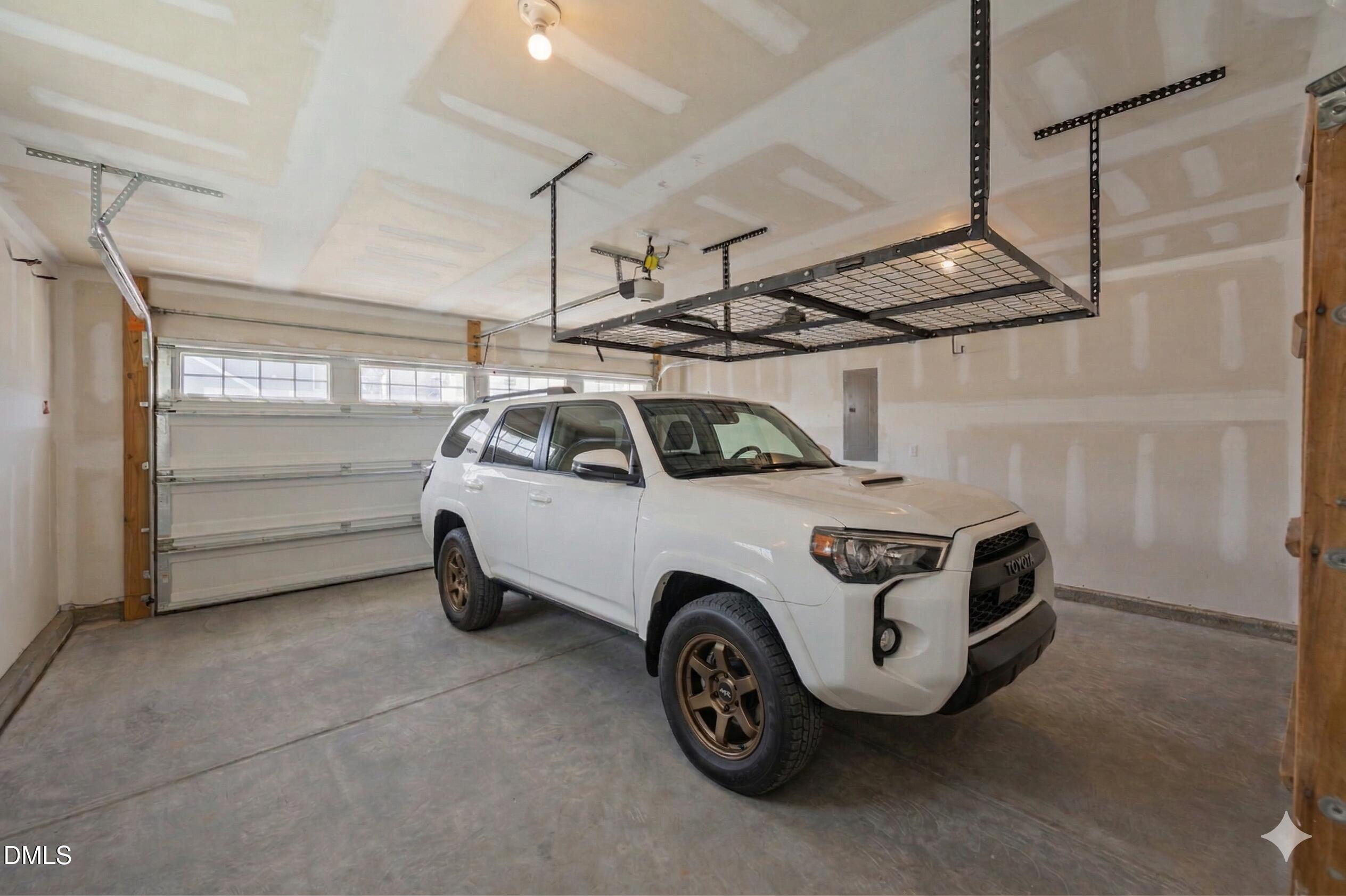 217 Masden Road Holly Springs, NC 27540 - Photo 28 of 32 a car parked in a garage
