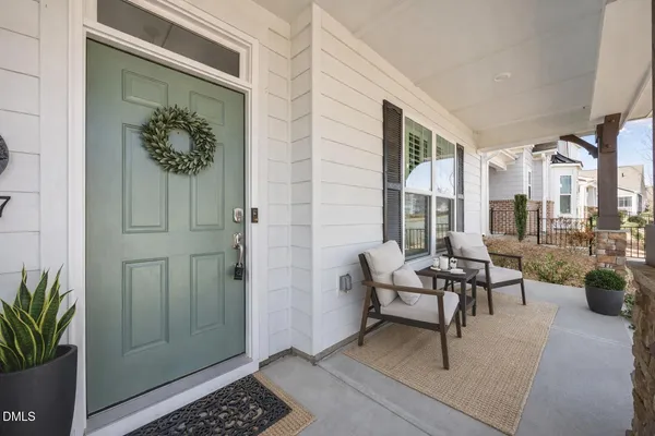 a view of a house with outdoor seating area and entertaining space