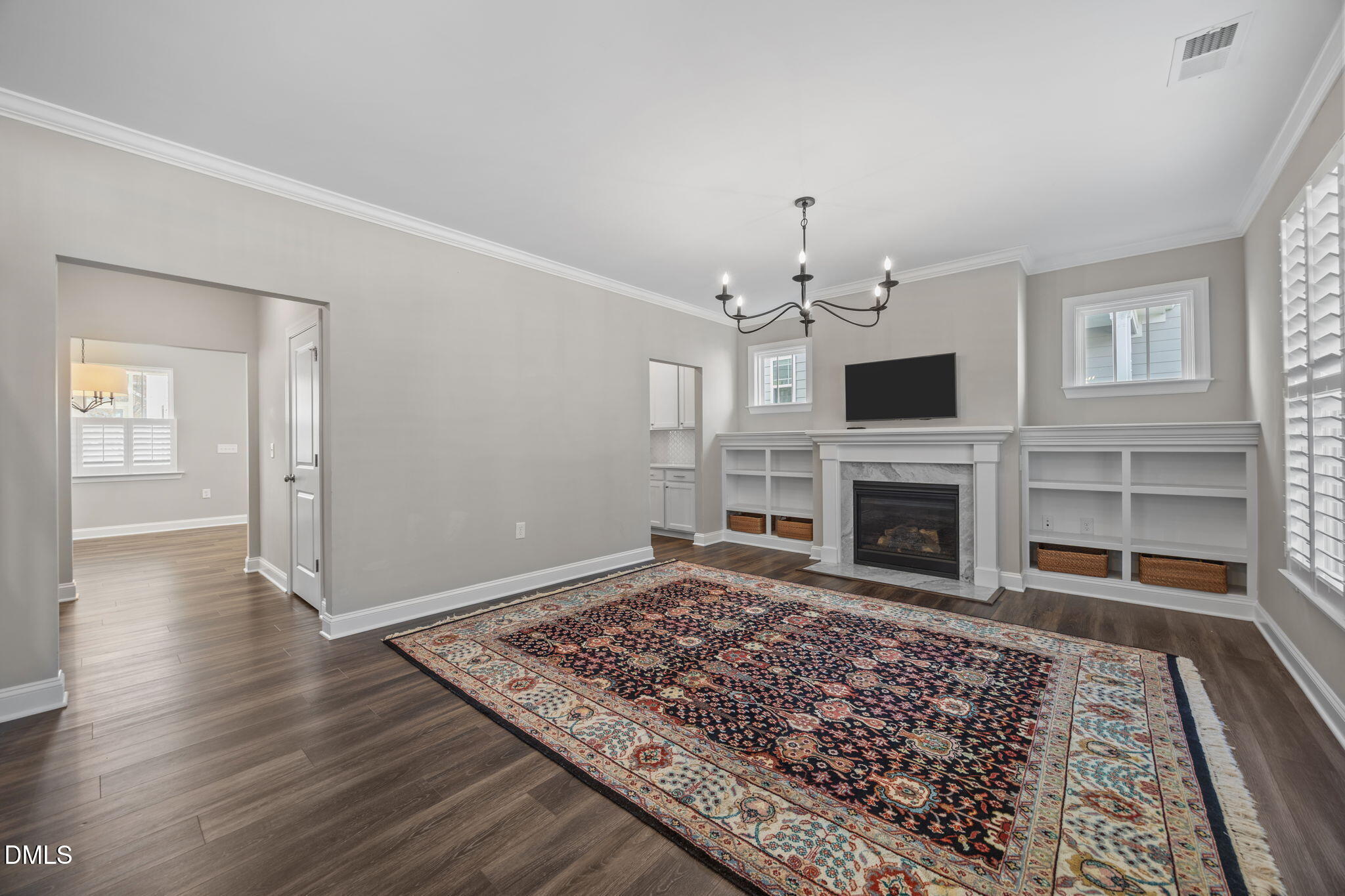 217 Masden Road Holly Springs, NC 27540 - Photo 5 of 32 a living room with a fireplace and a rug