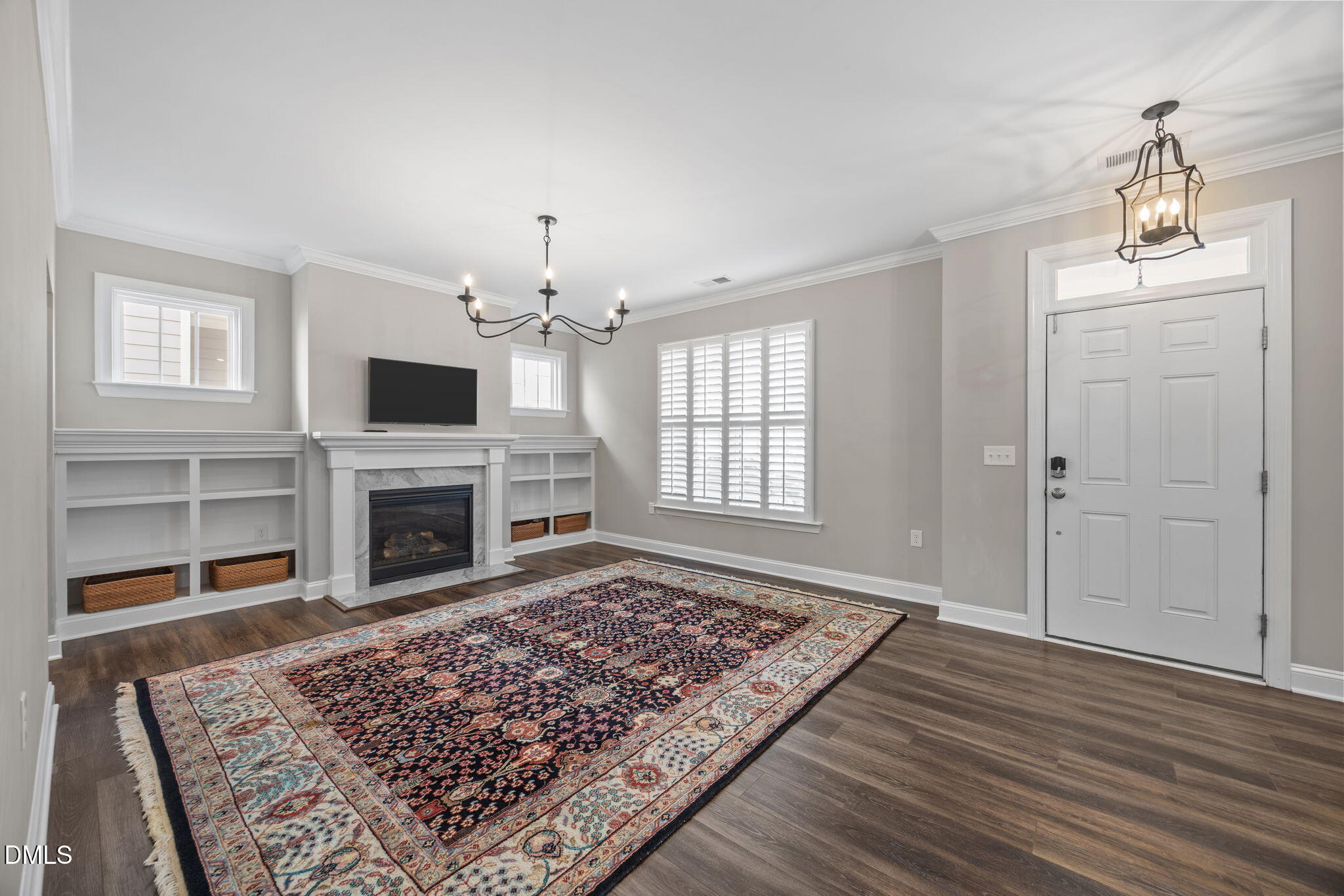217 Masden Road Holly Springs, NC 27540 - Photo 6 of 32 a living room with a rug and a fireplace