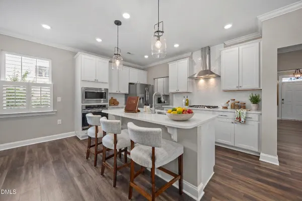 a living room with a rug and a fireplace