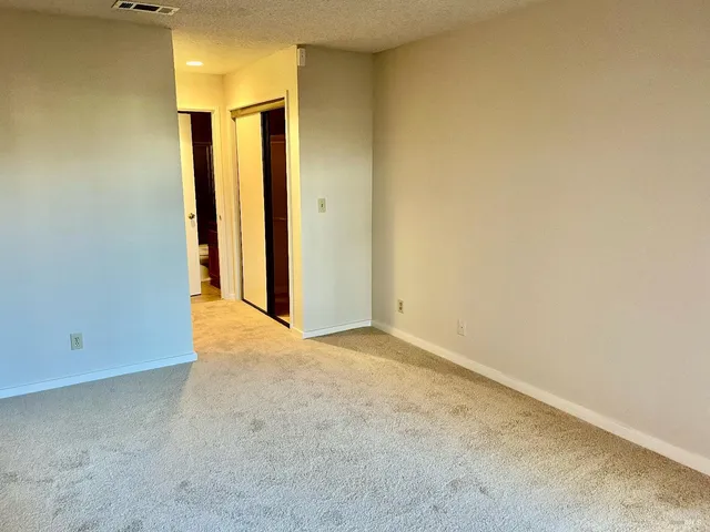 a kitchen with stainless steel appliances kitchen island granite countertop a sink and cabinets