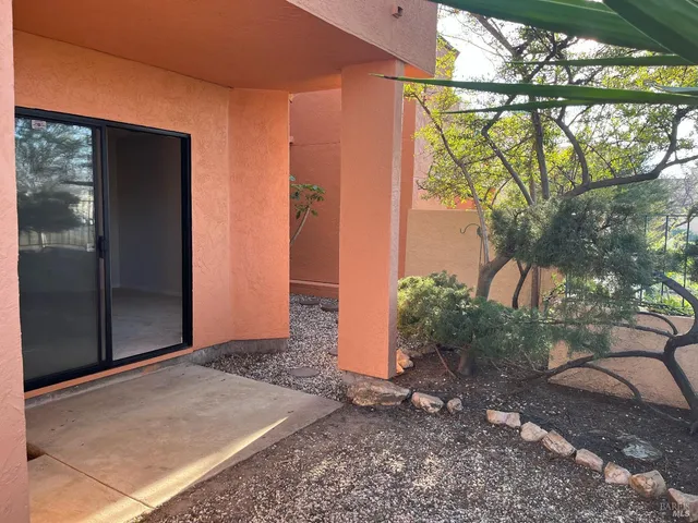 a vase of flowers sitting on a floor