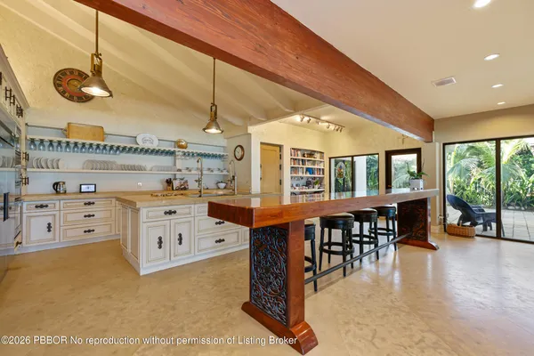 a view of a kitchen and dining room