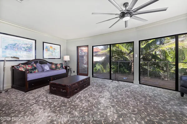 a spacious bedroom with a large bed and a large window