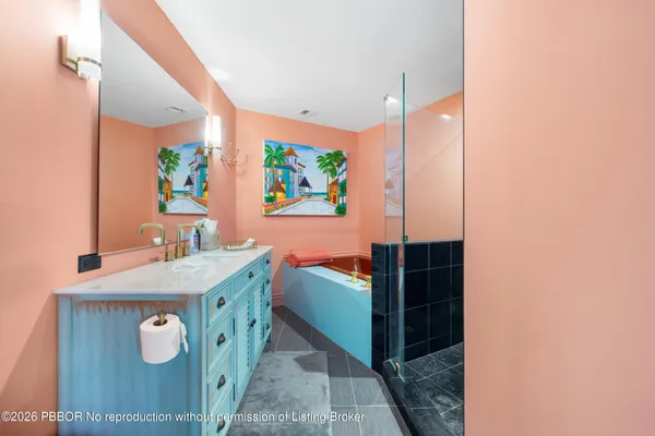 a bathroom with a sink a vanity and a mirror