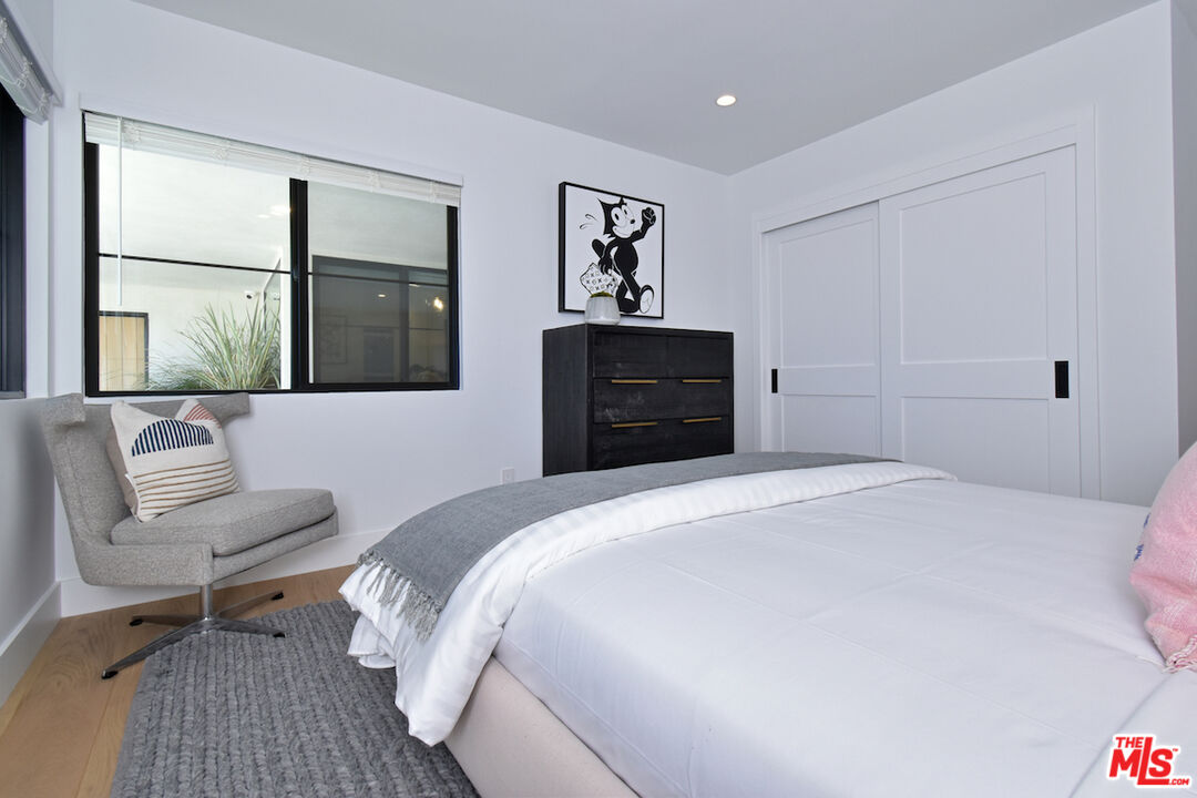 2037 Stradella Road Los Angeles, CA 90077 - Photo 19 of 33 a bedroom with a bed and a couch
