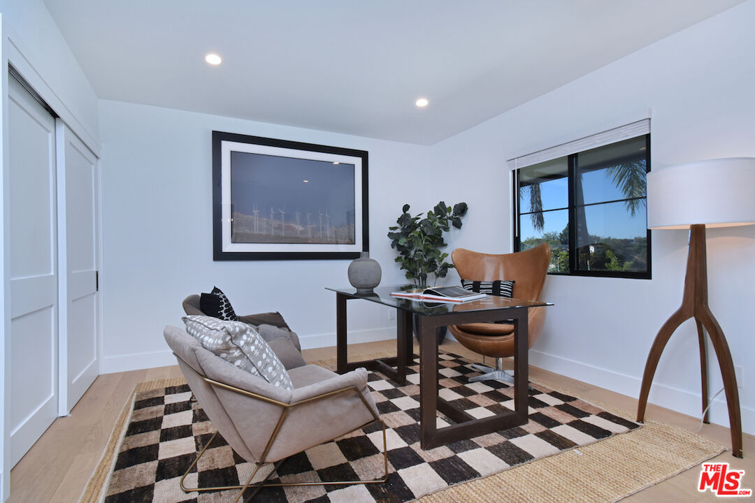 2037 Stradella Road Los Angeles, CA 90077 - Photo 21 of 33 a work room with furniture and wooden floor