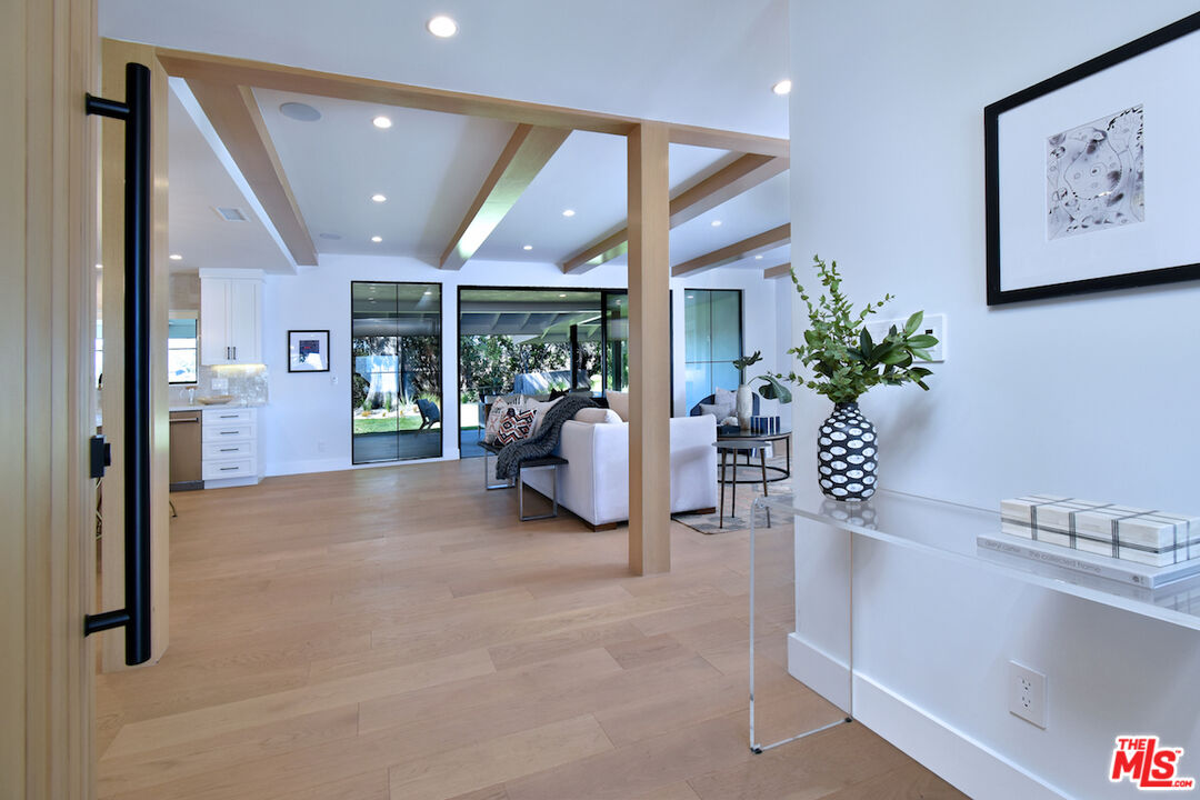 2037 Stradella Road Los Angeles, CA 90077 - Photo 4 of 33 a living room with furniture and a large window