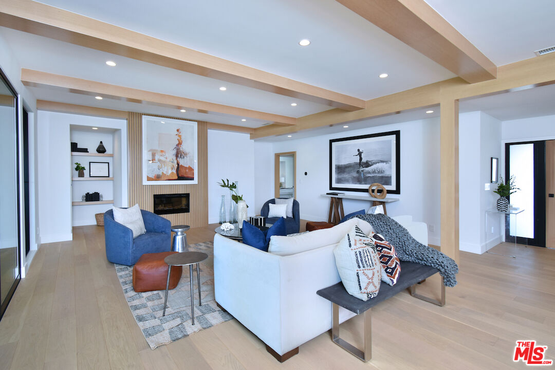 2037 Stradella Road Los Angeles, CA 90077 - Photo 5 of 33 a living room with furniture and a wooden floor