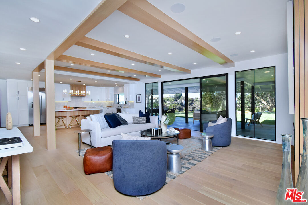 2037 Stradella Road Los Angeles, CA 90077 - Photo 7 of 33 a living room with furniture and a large window