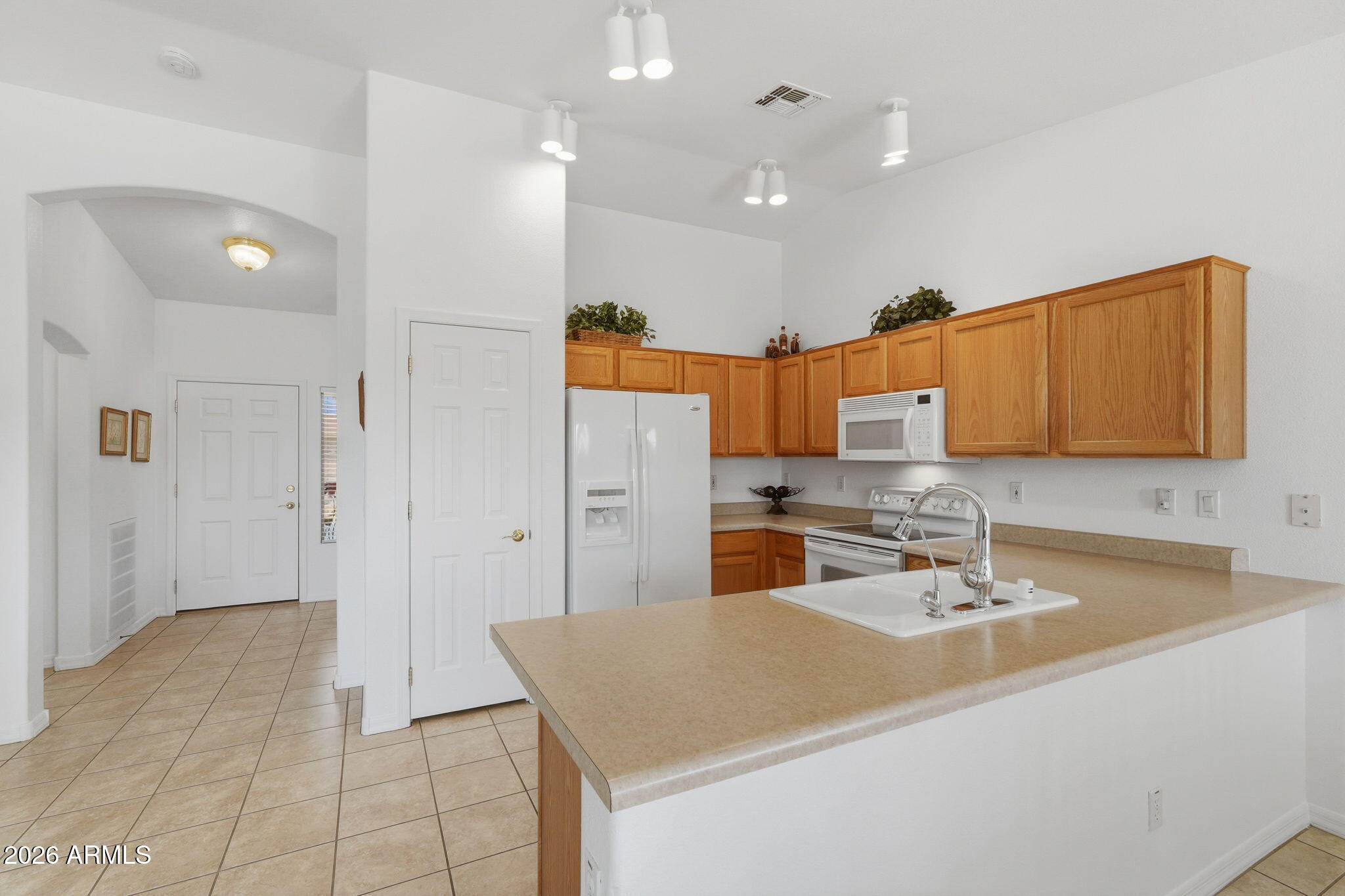 6317 South Pinaleno Place Chandler, AZ 85249 - Photo 11 of 45 a bathroom with a sink a mirror and a shower