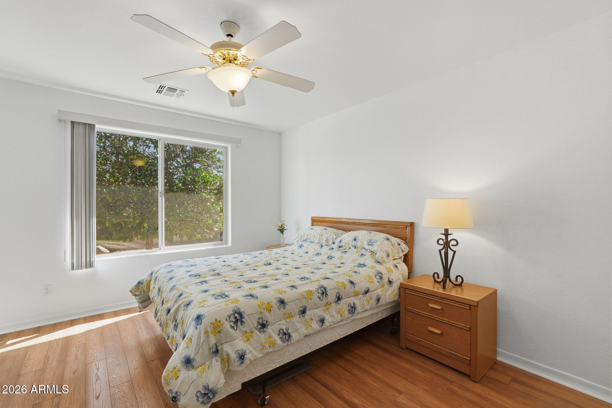 6317 South Pinaleno Place Chandler, AZ 85249 - Photo 15 of 45 a bedroom with a bed and a chandelier