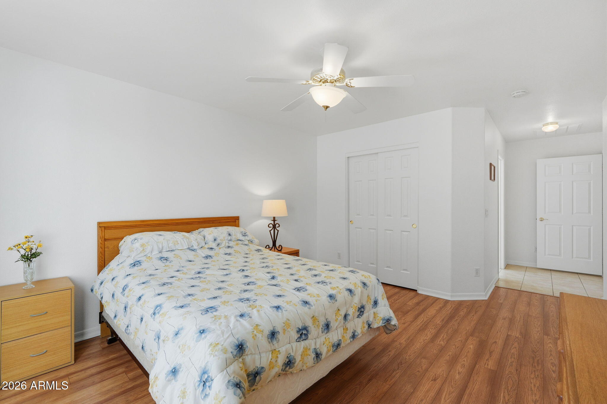 6317 South Pinaleno Place Chandler, AZ 85249 - Photo 16 of 45 a bedroom with a bed and wooden floor