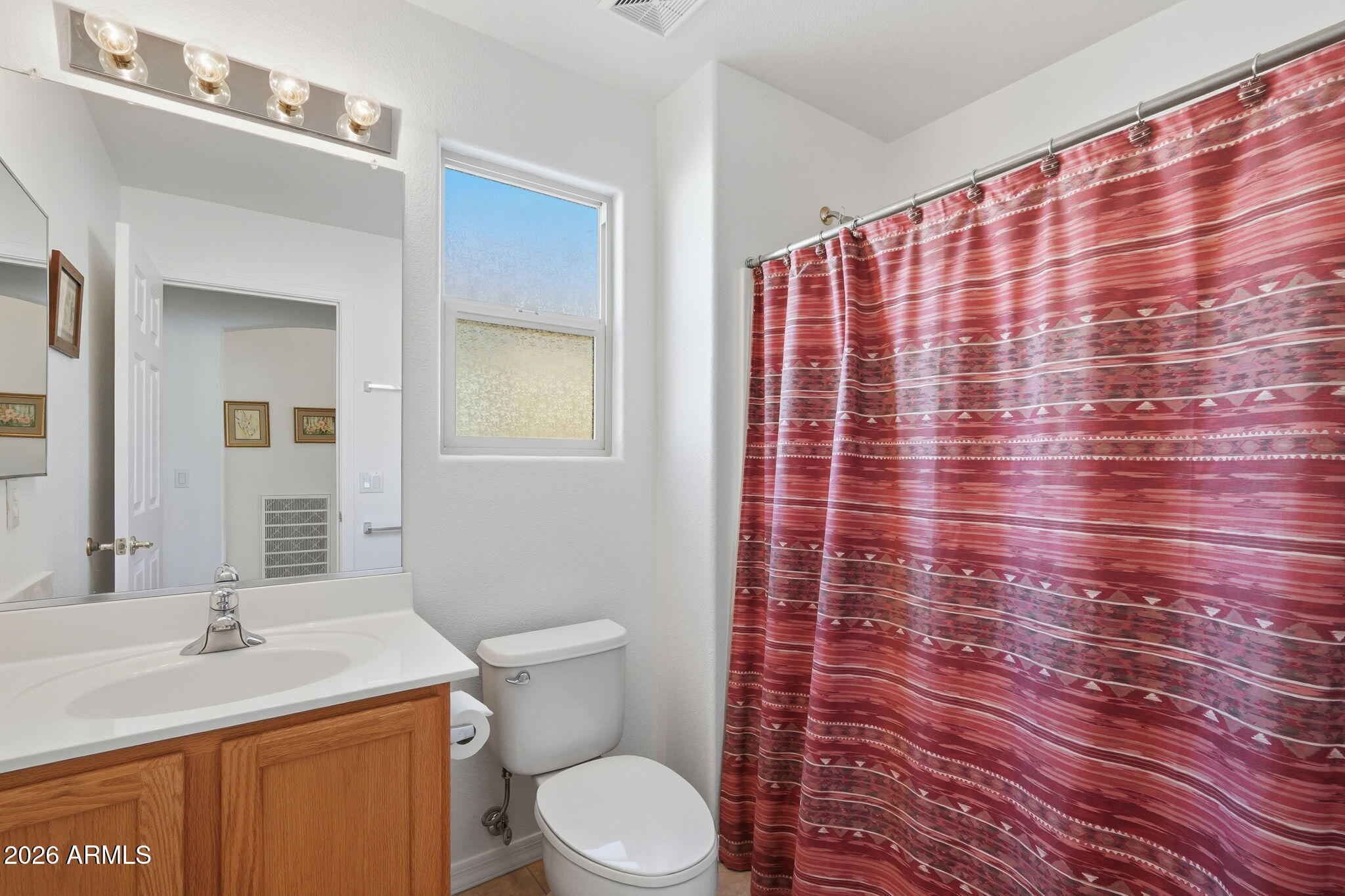 6317 South Pinaleno Place Chandler, AZ 85249 - Photo 22 of 45 a bathroom with a sink toilet and shower
