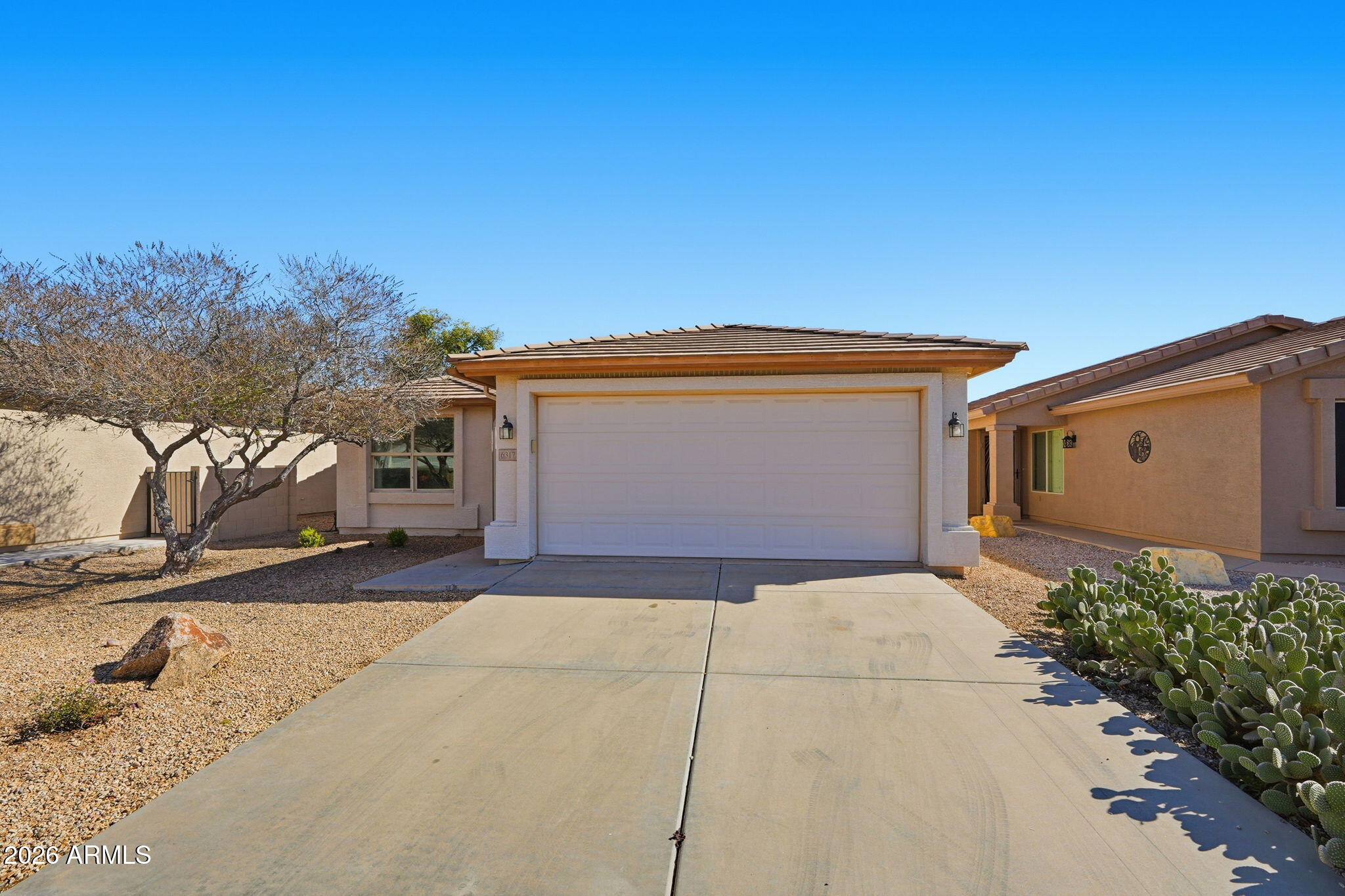 6317 South Pinaleno Place Chandler, AZ 85249 - Photo 31 of 45 a front view of a house with a garage