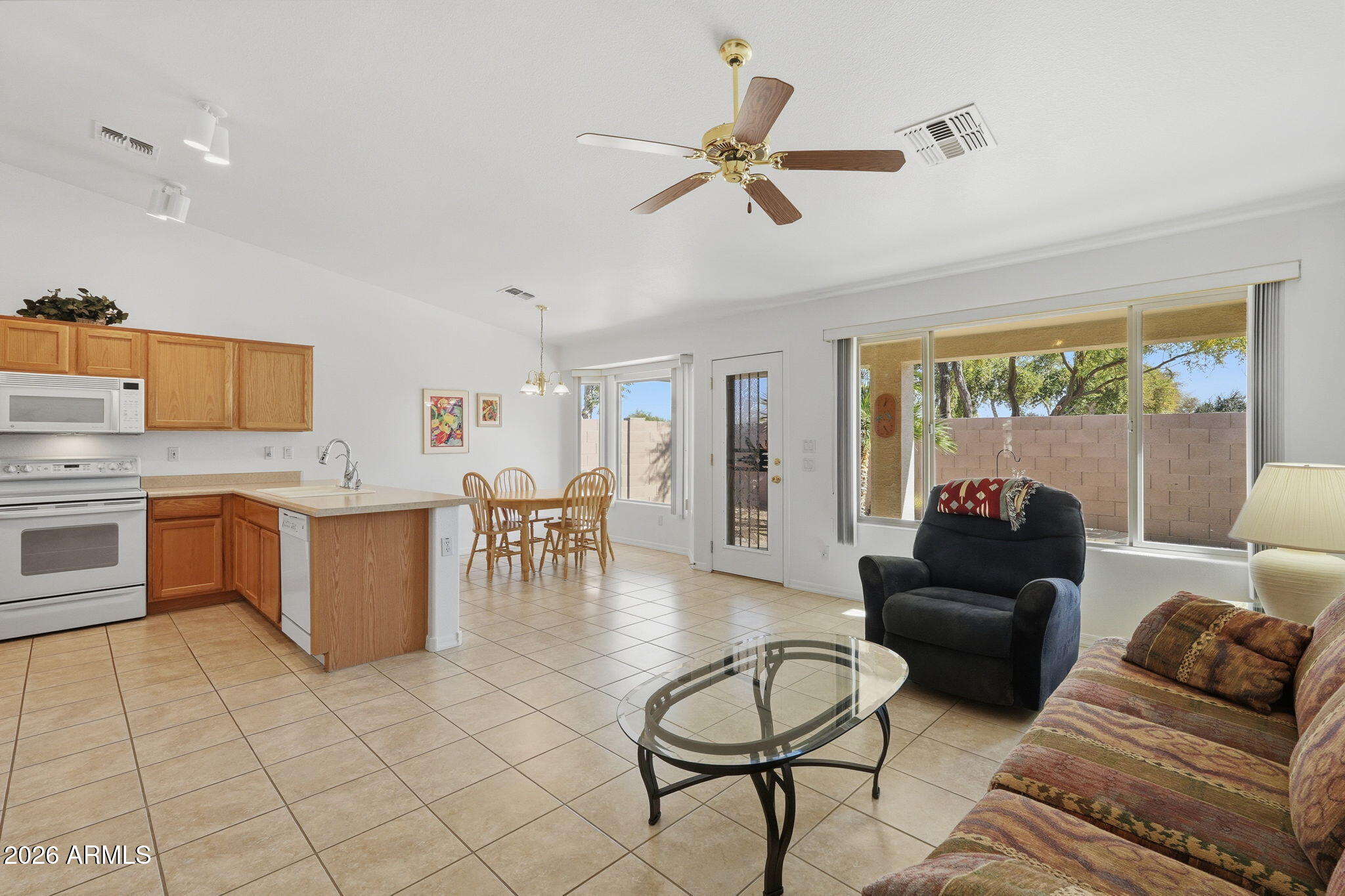 6317 South Pinaleno Place Chandler, AZ 85249 - Photo 7 of 45 a living room with furniture and a large window