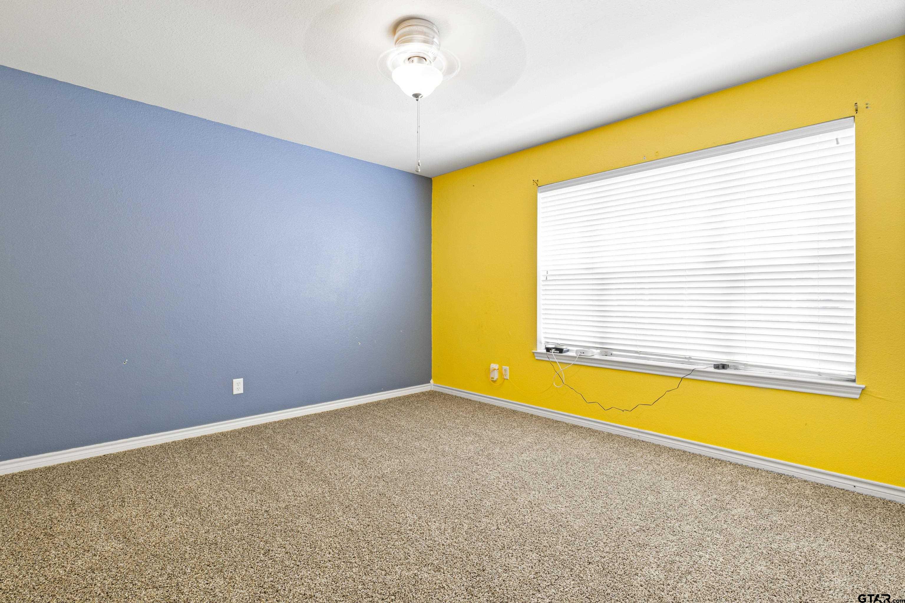 3631 Andrea Street Longview, TX 75604 - Photo 19 of 44 an empty room with a empty space and a window