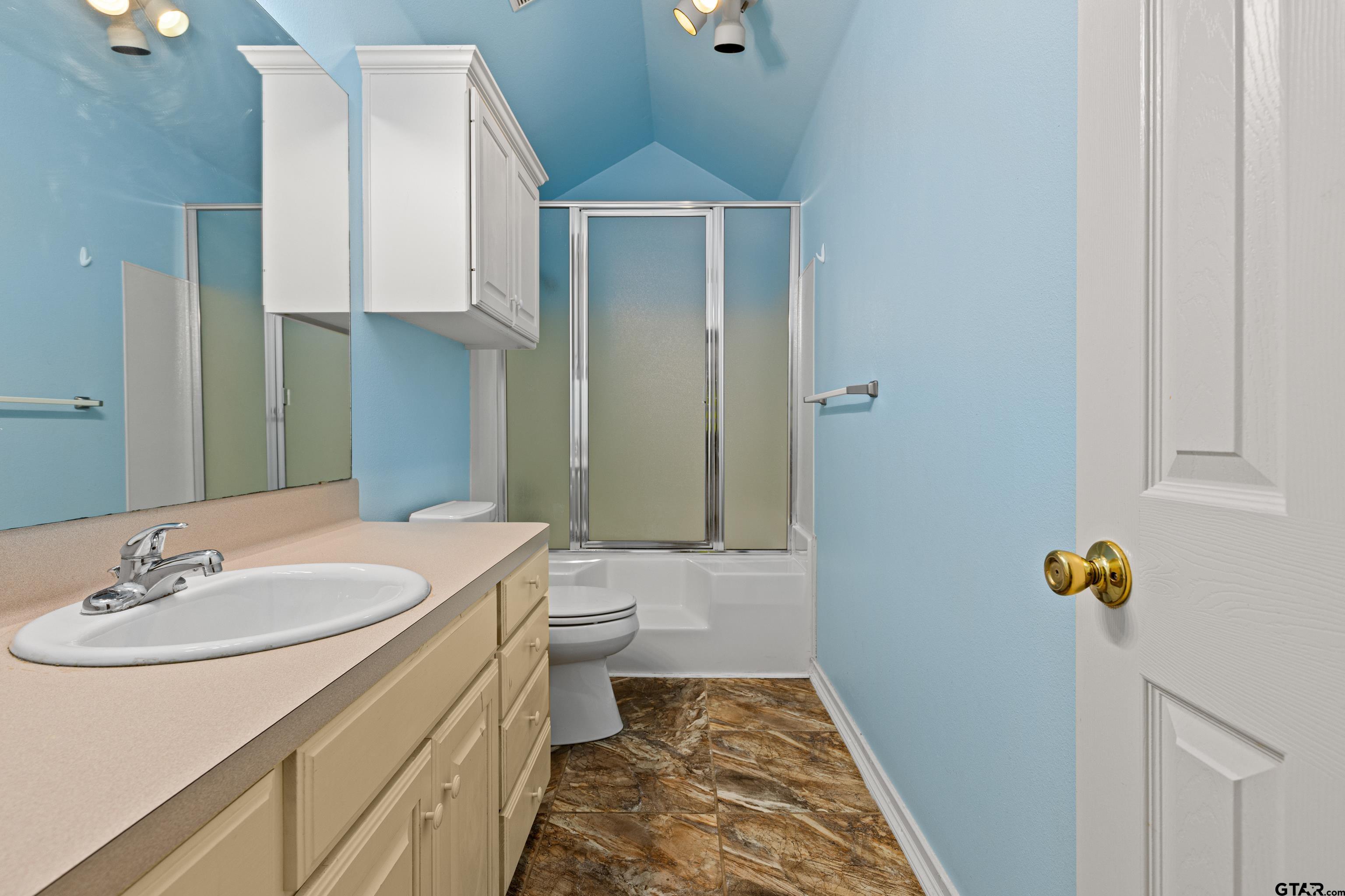 3631 Andrea Street Longview, TX 75604 - Photo 23 of 44 a bathroom with a sink toilet and shower