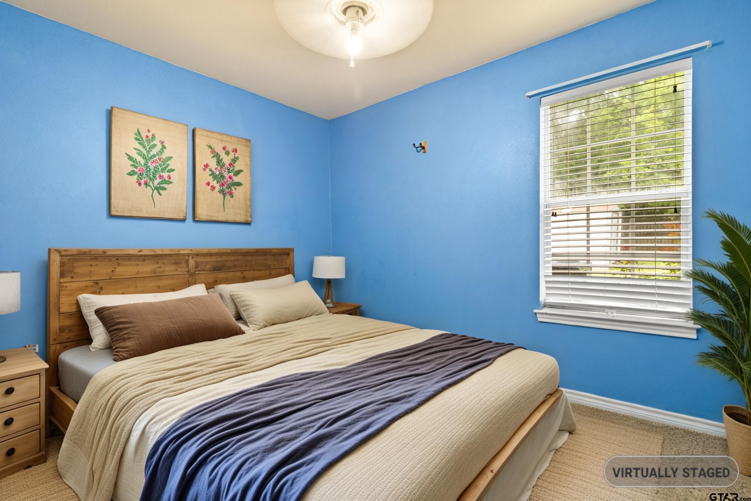 3631 Andrea Street Longview, TX 75604 - Photo 27 of 44 a bedroom with a bed and a window