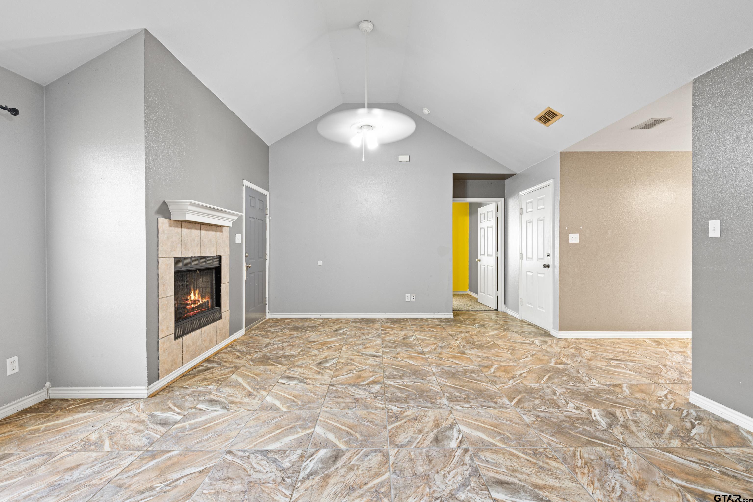 3631 Andrea Street Longview, TX 75604 - Photo 8 of 44 a view of an empty room with window and fire place