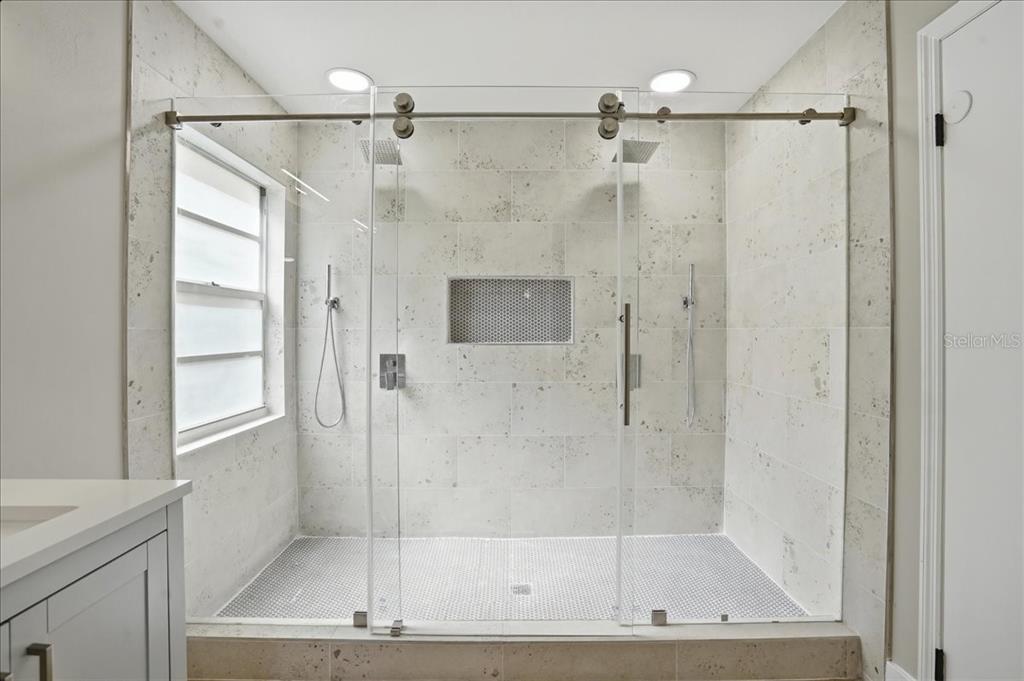 1723 Elk Spring Drive Brandon, FL 33511 - Photo 13 of 21 a bathroom with a glass shower door