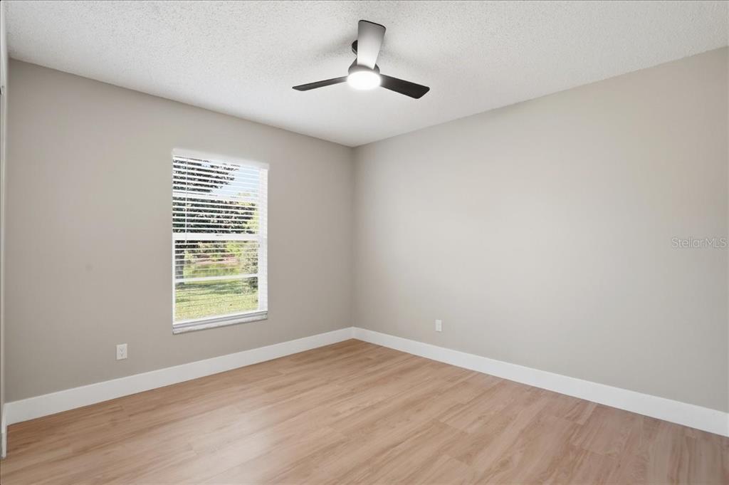 1723 Elk Spring Drive Brandon, FL 33511 - Photo 14 of 21 wooden floor in an empty room with a window