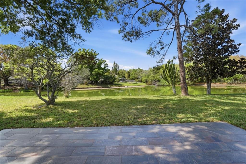 1723 Elk Spring Drive Brandon, FL 33511 - Photo 20 of 21 a view of a garden with a building in the background