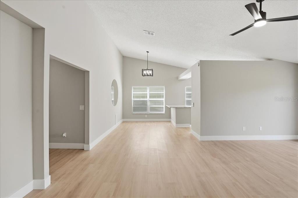 1723 Elk Spring Drive Brandon, FL 33511 - Photo 4 of 21 a view of a room with wooden floor and window
