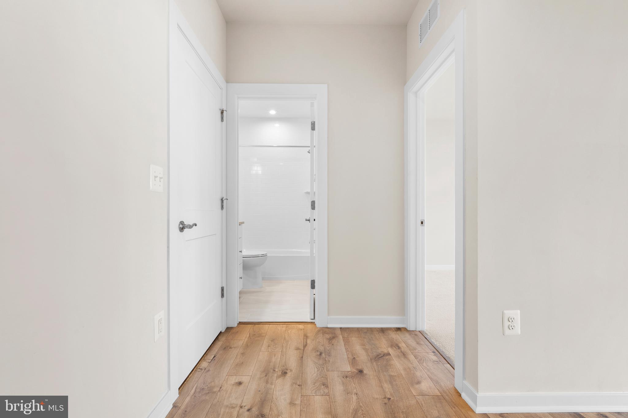 44487 Wolfhound Square Ashburn, VA 20147 - Photo 20 of 39 a view of a room with wooden floor and a bathroom