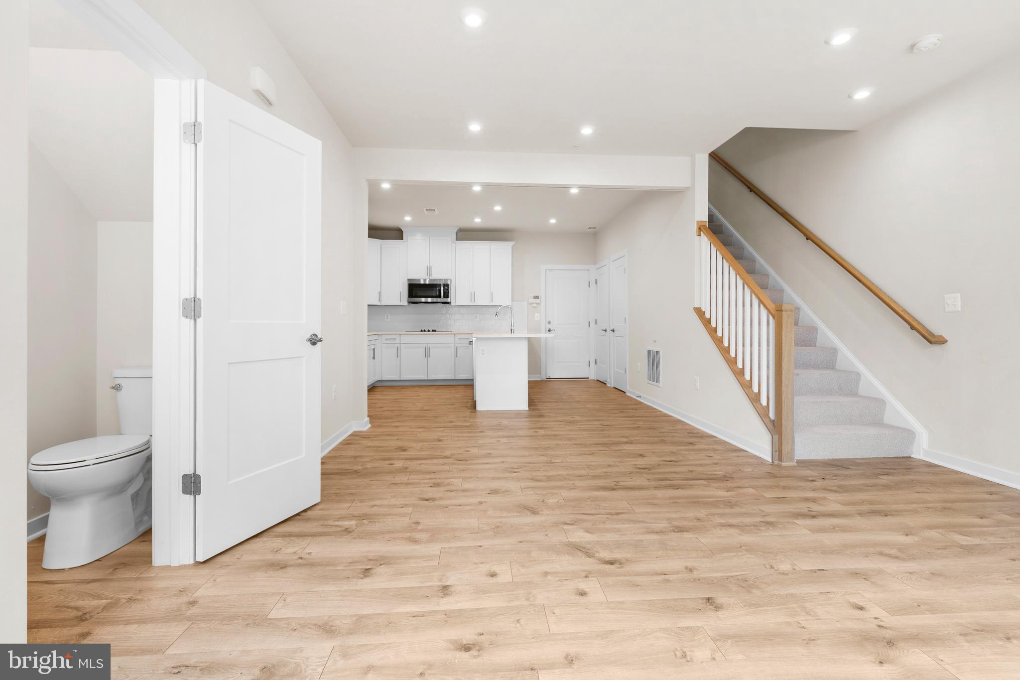 44487 Wolfhound Square Ashburn, VA 20147 - Photo 4 of 39 a view of kitchen and hall with wooden floor