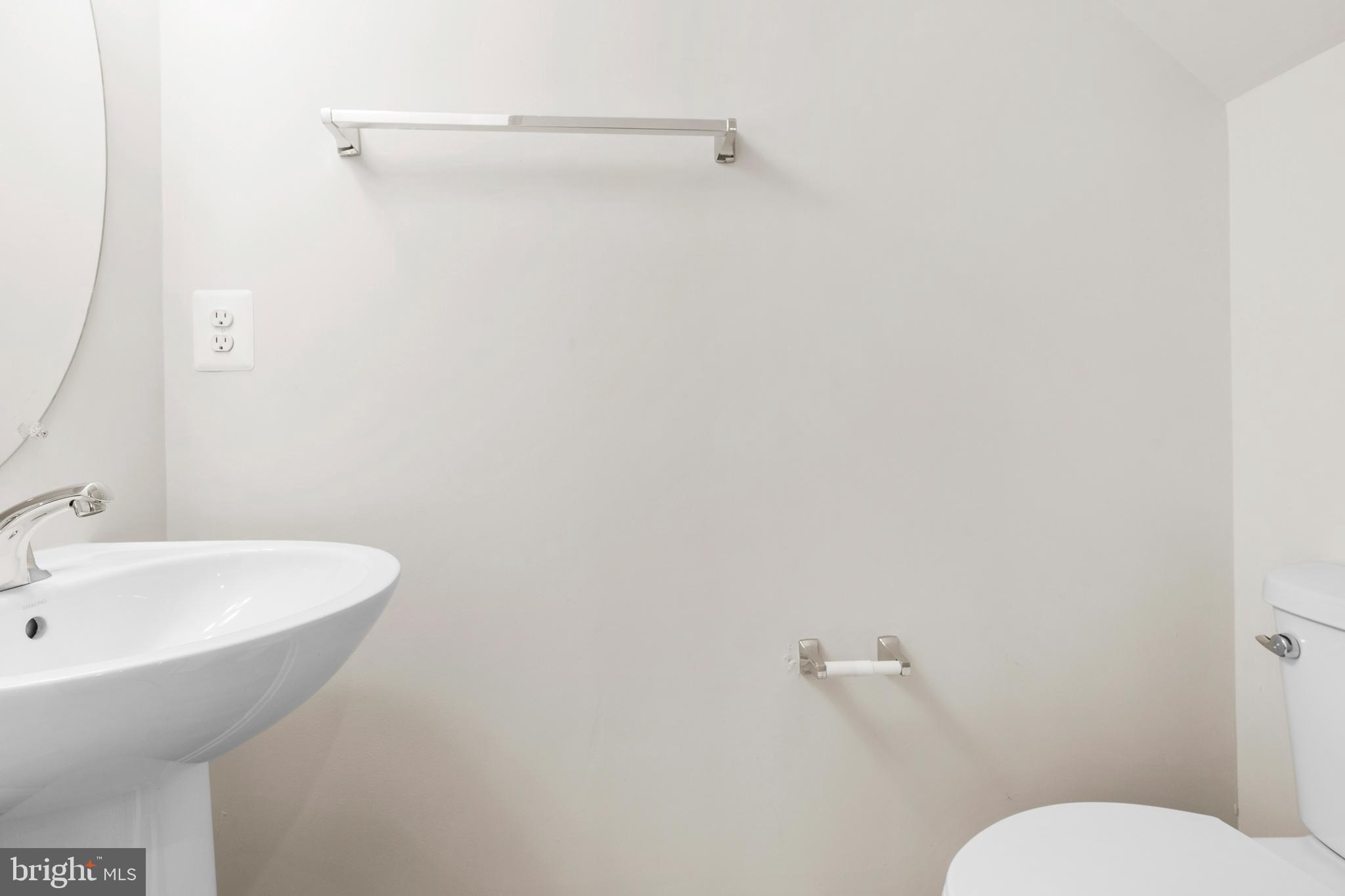 44487 Wolfhound Square Ashburn, VA 20147 - Photo 5 of 39 a bathroom with a sink a toilet and mirror