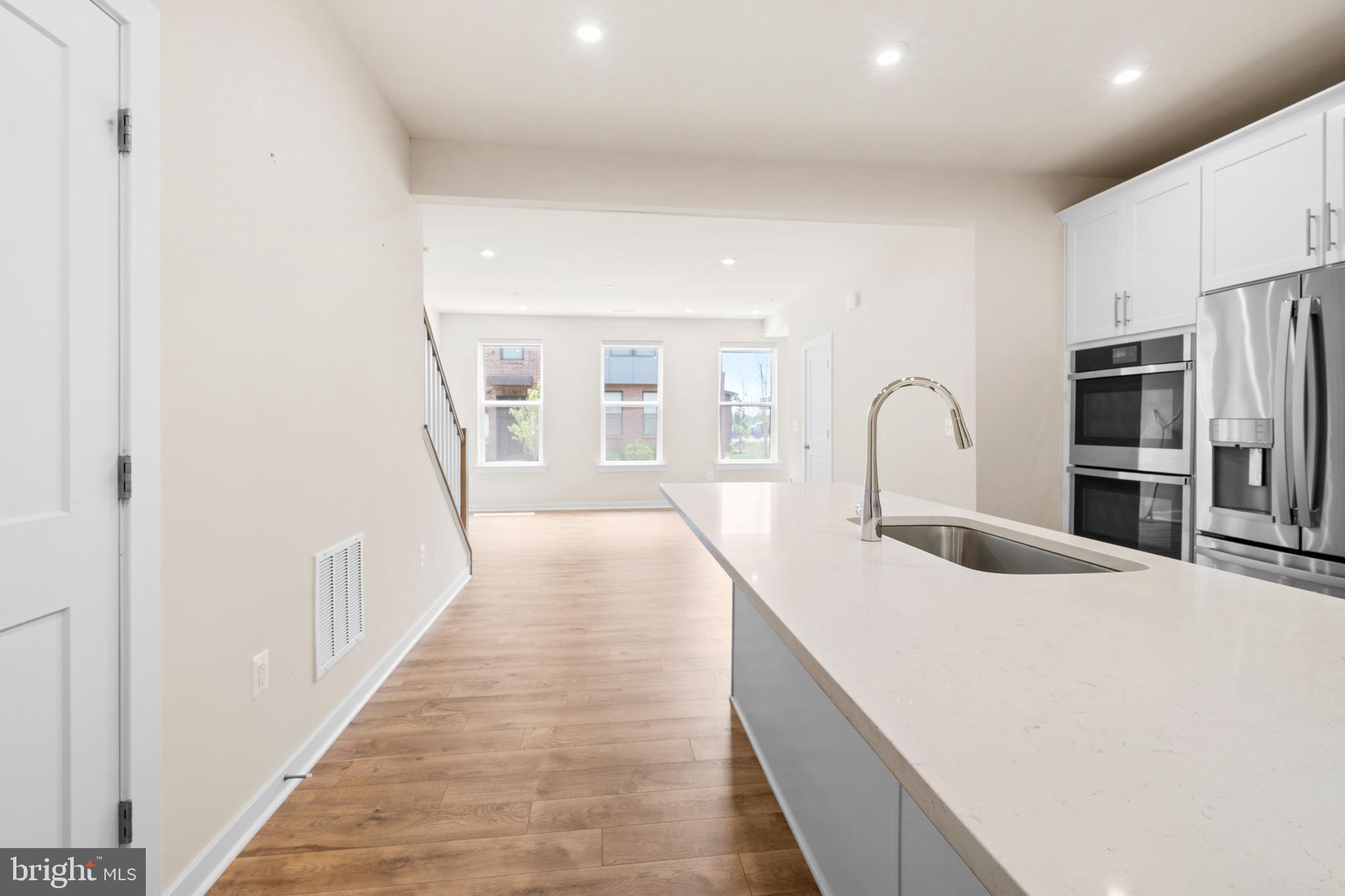 44487 Wolfhound Square Ashburn, VA 20147 - Photo 8 of 39 a bedroom with bed and a large window