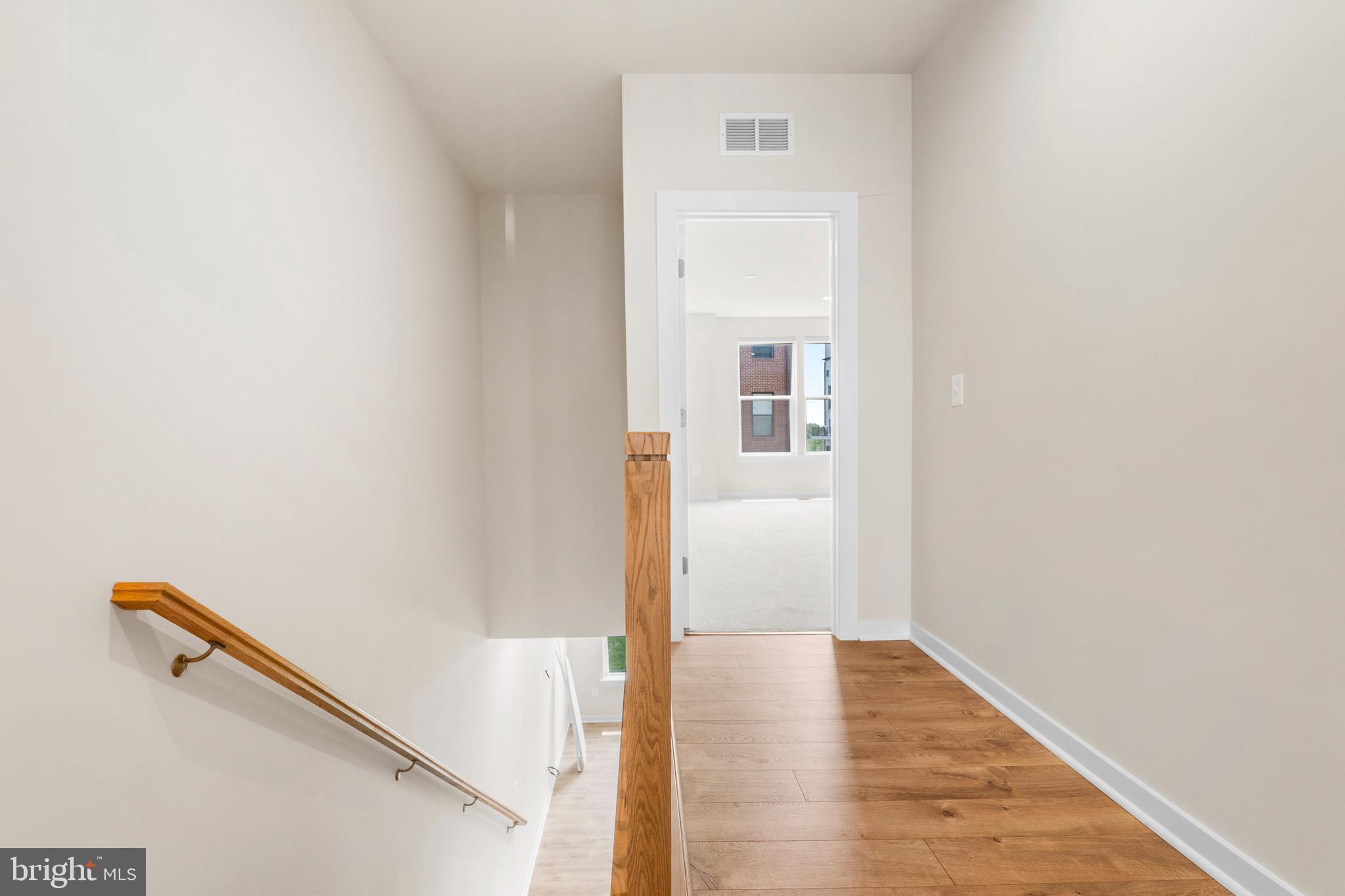 44487 Wolfhound Square Ashburn, VA 20147 - Photo 10 of 39 a view of a hallway with wooden floor