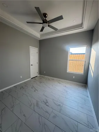 a view of an empty room and a window