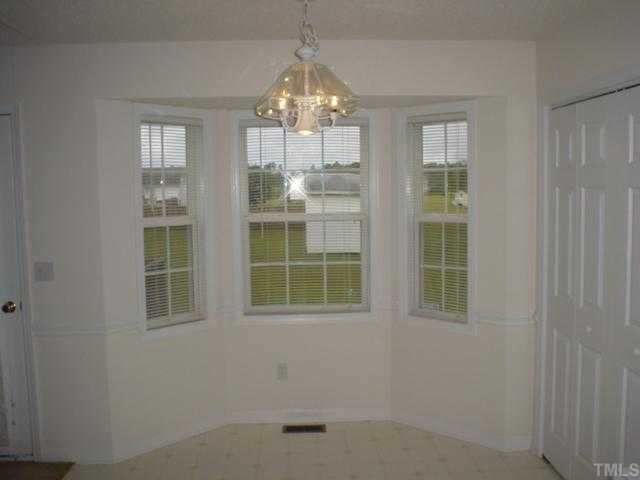 Bay window dining area looking out into huge backyard. Breakfast Area
