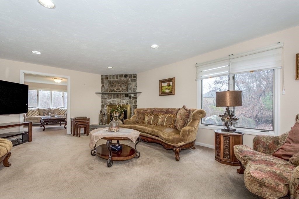 6 Juniper Road Sharon, MA 02067 - Photo 18 of 42 a living room with furniture and a flat screen tv