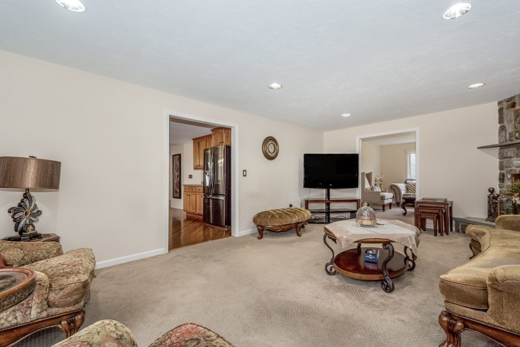 6 Juniper Road Sharon, MA 02067 - Photo 19 of 42 a living room with furniture and a flat screen tv