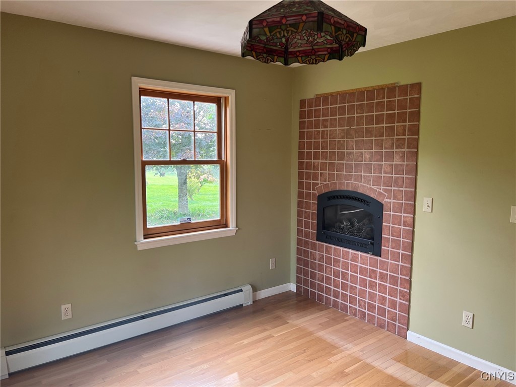 9996 Campbell Road Paris, NY 13456 - Photo 11 of 34 Gas fireplace downstairs bedroom or den