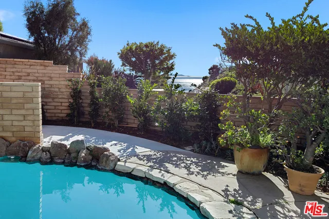 a bathroom with a sink toilet and mirror