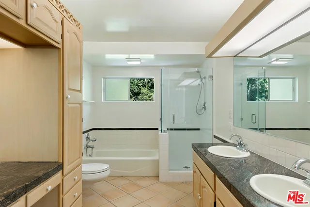 a view of a house with backyard sitting area and garden