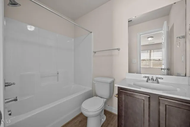 a bathroom with a sink toilet tub and vanity