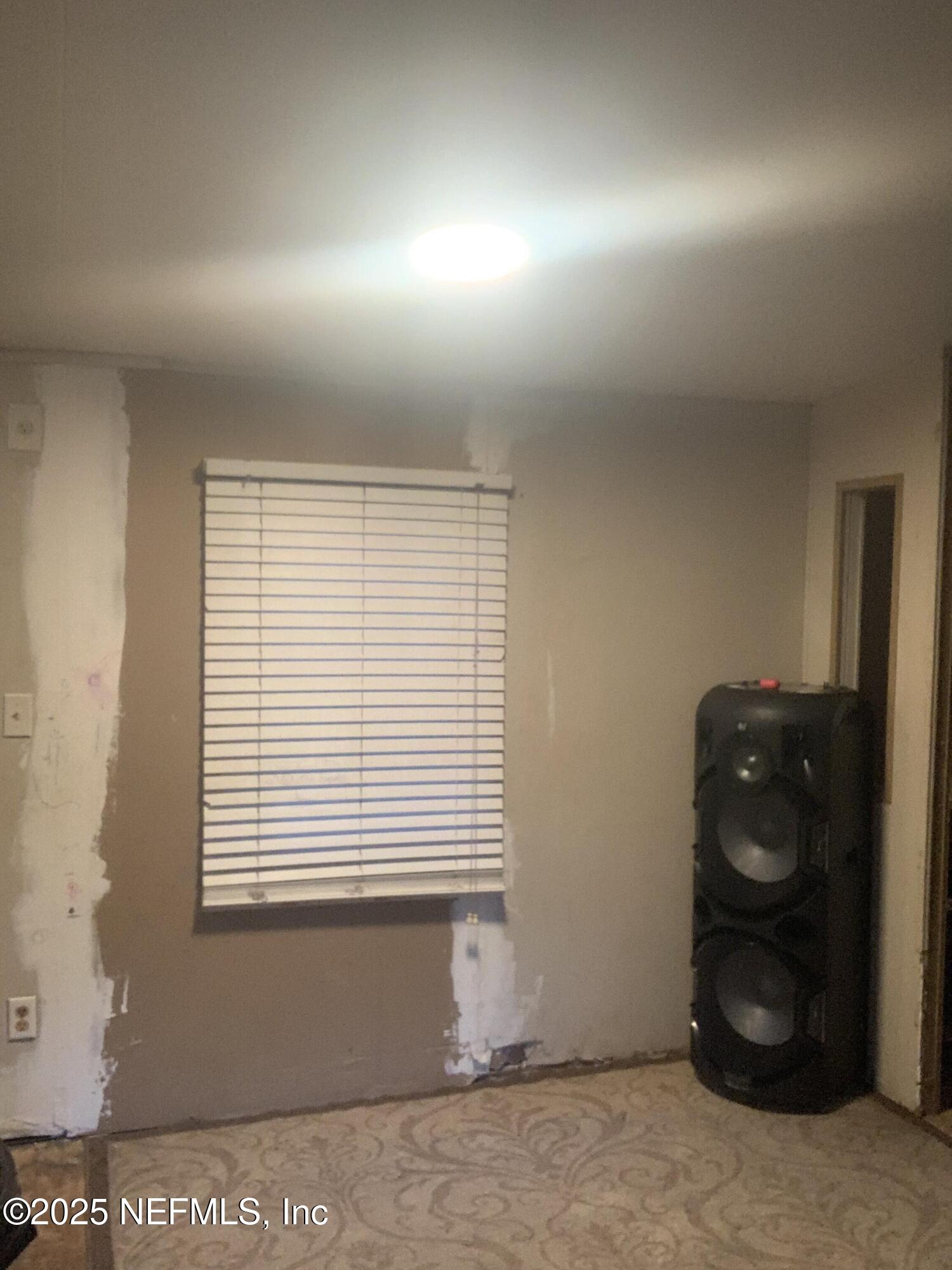 10017 Factory Avenue Hampton, FL 32044 - Photo 9 of 11 a bathroom with a window