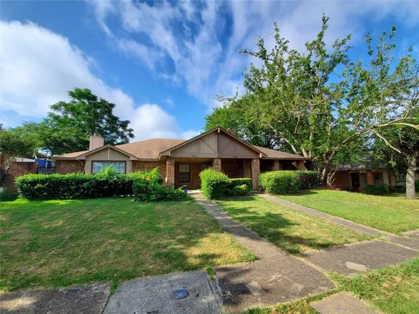 a view of a big yard in front of a house