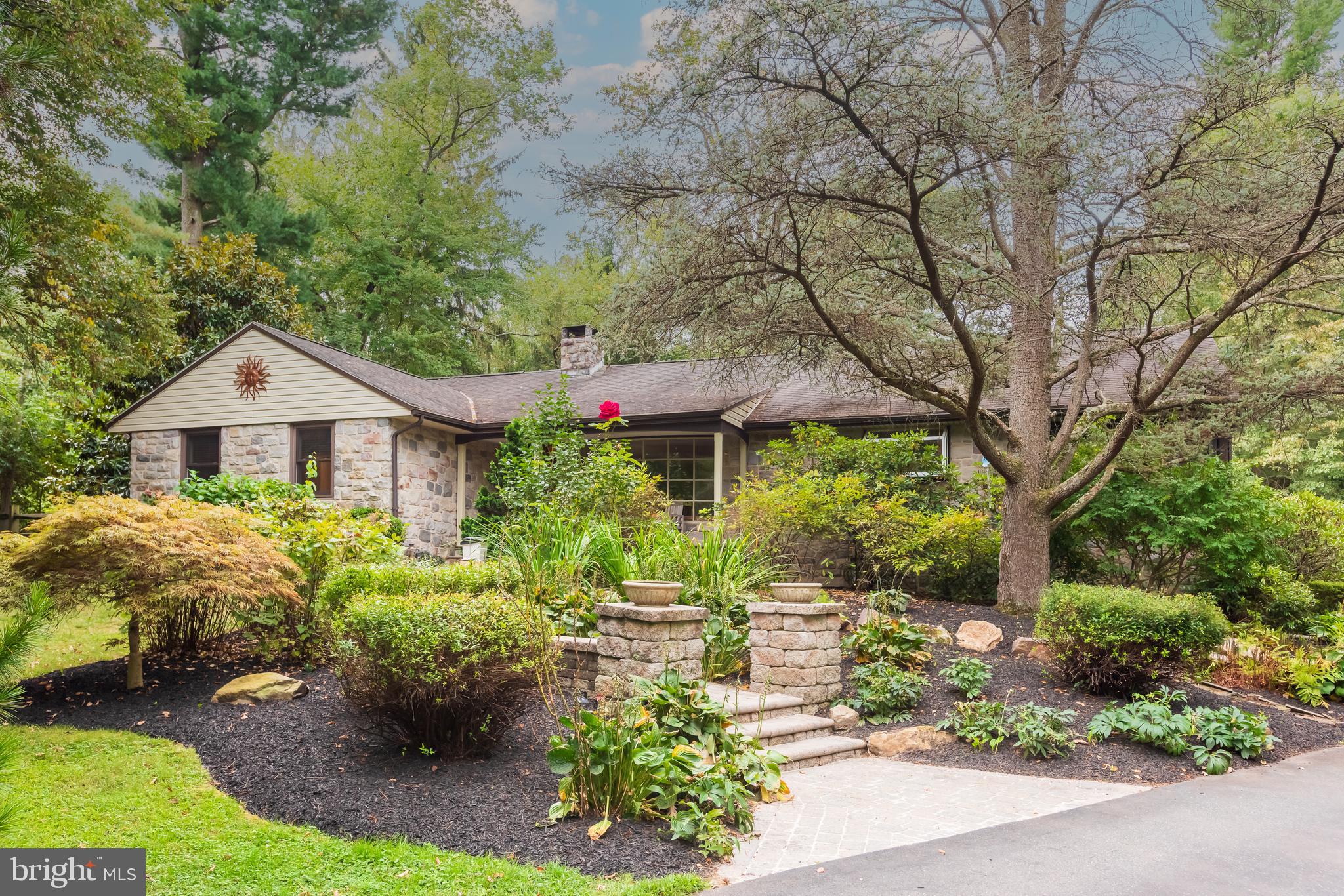 214 Creamery Road Spring City, PA 19475 - Photo 1 of 51 a front view of a house with a yard and potted plants